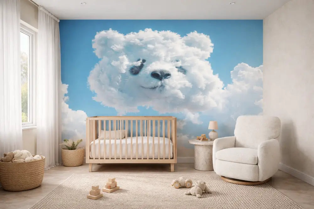 Une fresque murale en forme de nuage fantaisiste présentant un visage d’ours en peluche blanc doux avec des yeux et un nez noirs, sur un fond de ciel bleu clair.