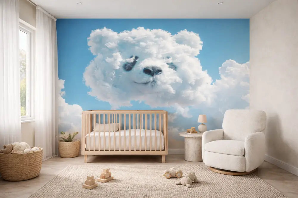 Une fresque murale en forme de nuage fantaisiste présentant un visage d’ours en peluche blanc doux avec des yeux et un nez noirs, sur un fond de ciel bleu clair.