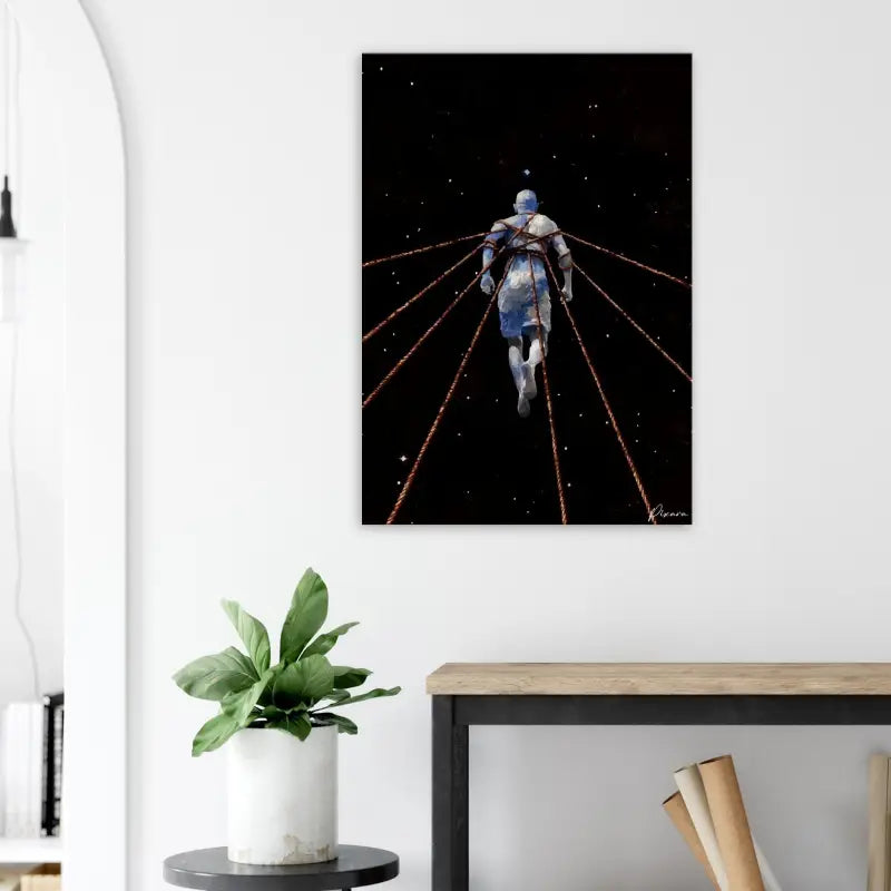 Un tirage sur toile rectangulaire mettant en scène un astronaute stylisé en tenue bleue et blanche s’éloignant dans l’espace, attaché par des lignes rouges lumineuses sur un fond noir étoilé.