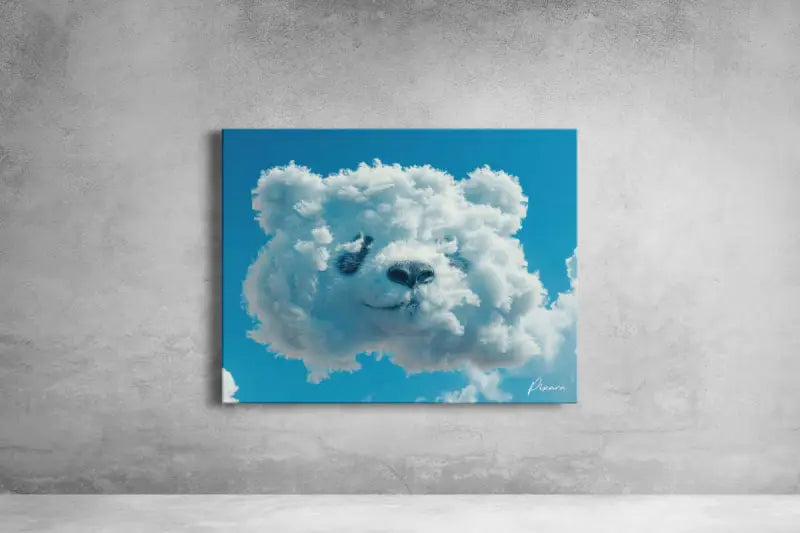 Un tirage sur toile rectangulaire représentant un nuage blanc et duveteux en forme de visage d’ours sur un ciel bleu vibrant.