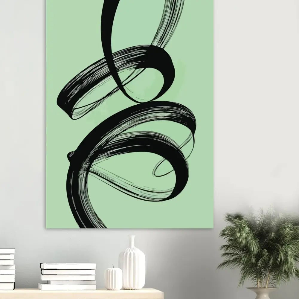 Œuvre abstraite au pinceau noir sur une toile vert menthe.