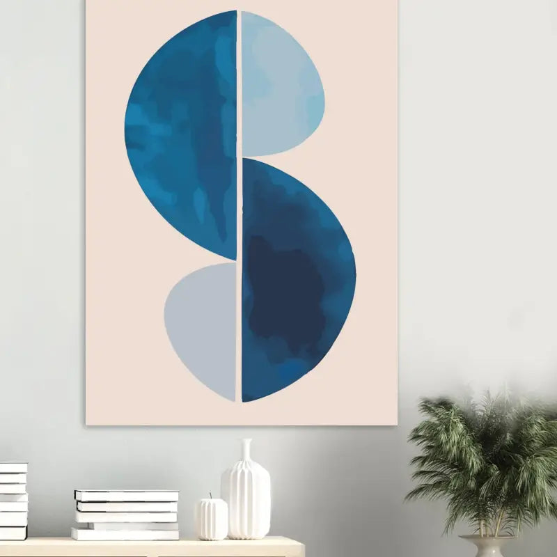 Un tirage sur toile abstrait moderne présentant deux demi-cercles bleus superposés, l’un en bleu marine profond et l’autre en bleu ciel plus clair, sur un fond rose pâle doux.