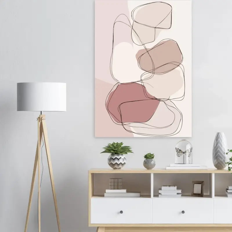 Art abstrait sur toile mettant en scène des formes géométriques en rose doux, beige et mauve, délimitées par de fines lignes noires.