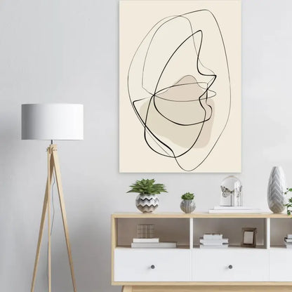 Toile d’art abstrait aux lignes beiges avec contours noirs et une forme beige douce.