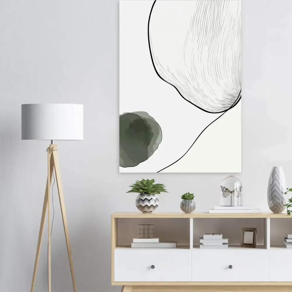 Art abstrait sur toile avec des lignes noires audacieuses et des taches vert olive doux sur un fond blanc propre.