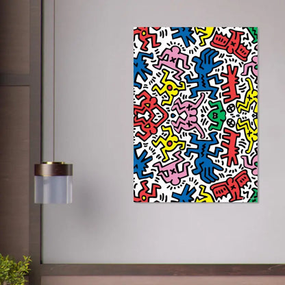 Impression sur toile vibrante et colorée mettant en scène les figures stylisées emblématiques de Keith Haring en rouge, bleu, rose, jaune et vert sur un fond blanc.