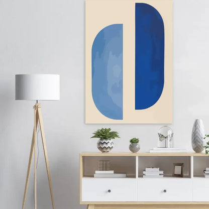 Peinture abstraite sur toile beige présentant deux formes ovales verticales en diverses nuances de bleu.