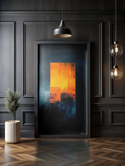 Une peinture abstraite frappante avec des coups de pinceau audacieux orange et bleu sur un fond sombre, encadrée dans un cadre noir élégant.