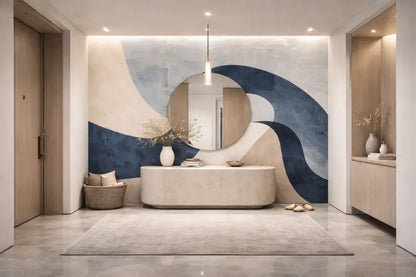 Un miroir élégant en forme ovale avec un cadre minimaliste est suspendu au centre au-dessus d’une table console moderne dans un vestibule élégamment conçu.