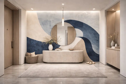 Un miroir élégant en forme ovale avec un cadre minimaliste est suspendu au centre au-dessus d’une table console moderne dans un vestibule élégamment conçu.