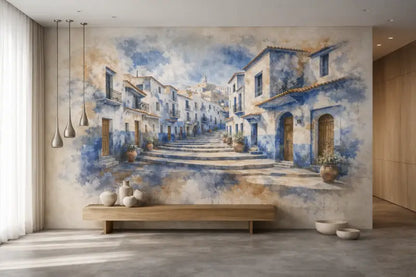 Fresque à l’aquarelle représentant une rue pavée bordée de bâtiments blanchis à la chaux et d’accents bleus, avec des plantes en pots en terre cuite.