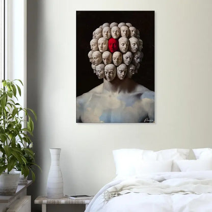 Une impression sur toile frappante présentant un portrait surréaliste d’une figure aux multiples visages, l’un proéminent en rouge et les autres en tons feutrés, sur un fond sombre.