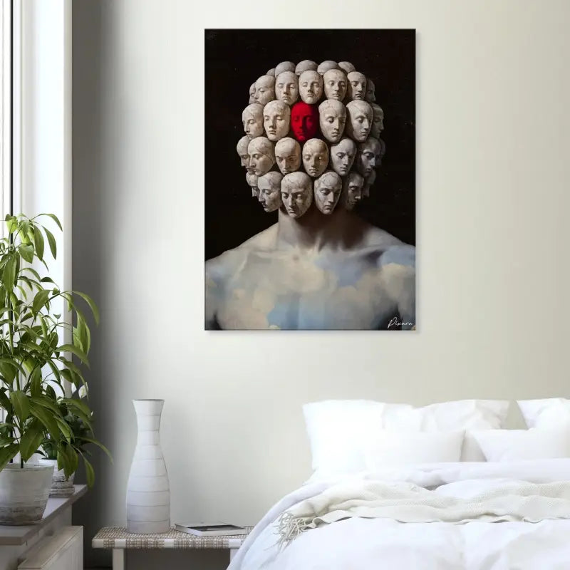 Une impression sur toile frappante présentant un portrait surréaliste d’une figure aux multiples visages, l’un proéminent en rouge et les autres en tons feutrés, sur un fond sombre.