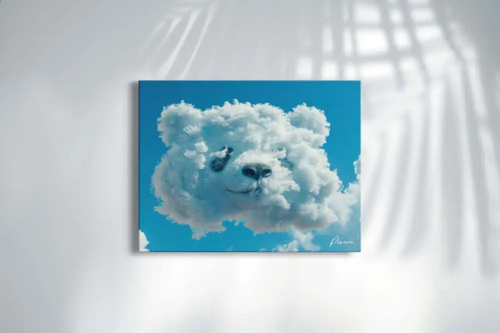 Un tirage sur toile rectangulaire mettant en scène un nuage blanc et duveteux en forme de visage d’ours sur un ciel bleu vibrant.